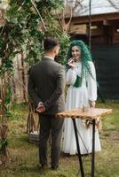 wedding ceremony of the newlyweds in a country cottage photo