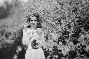 young girl bride with green hair in a national dress photo