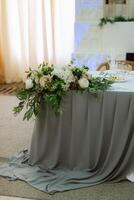 The presidium of the newlyweds in the banquet hall of the restaurant photo