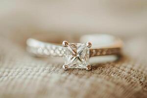 AI Generated Princess Cut diamond engagement ring with sparkling gemstone. Central stone with small diamonds photo