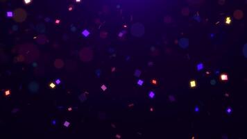 Falling multi-colored confetti particles and beautiful glowing bokeh. Colorful abstract background 3D, 4K, seamless loop video