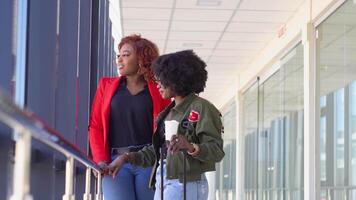 Two african american girlfriends are waiting to boarding and departing at the airport video