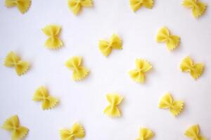 There are a lot of butterfly-shaped pasta on the table. photo