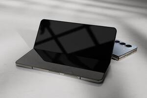 Foldable smartphone mockup with shadows overlay and screen reflection photo