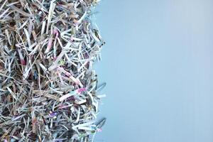 The shredded paper on light blue background. photo