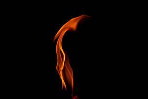 Hot flames on a black background. Beautiful flame of fire in the dark. Abstract of burning flames and smoke. photo