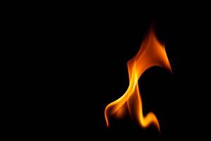 Hot flames on a black background. Beautiful flame of fire in the dark. Abstract of burning flames and smoke. photo