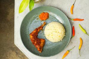 fried chicken with rice and chili photo