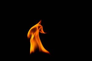 Hot flames on a black background. Beautiful flame of fire in the dark. Abstract of burning flames and smoke. photo