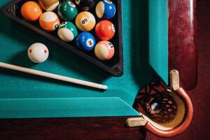 Billiard table with green surface and balls in the billiard club.Pool Game photo