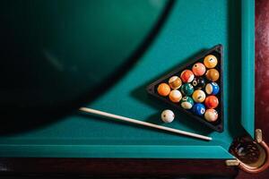 Billiard table with green surface and balls in the billiard club.Pool Game photo