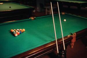 Billiard table with green surface and balls in the billiard club.Pool Game photo