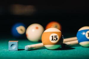 Billiard table with green surface and balls in the billiard club.Pool Game photo