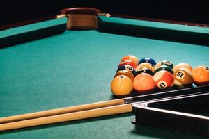 Billiard table with green surface and balls in the billiard club.Pool Game photo