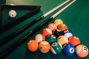 Billiard table with green surface and balls in the billiard club.Pool Game photo