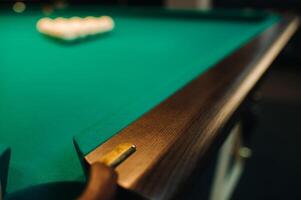 The oak decorative leg of a billiard table looks expensive photo