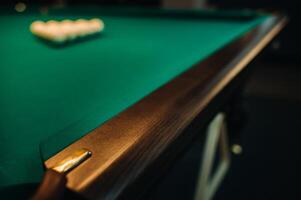 The oak decorative leg of a billiard table looks expensive photo