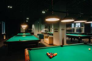 Billiard table with green surface and balls in the billiard club.Pool Game photo