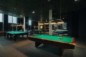 Billiard table with green surface and balls in the billiard club.Pool Game photo