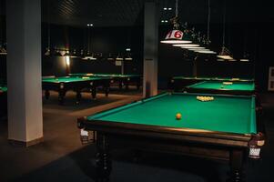 Billiard table with green surface and balls in the billiard club.Pool Game photo