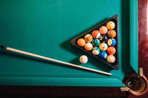 Billiard table with green surface and balls in the billiard club.Pool Game photo