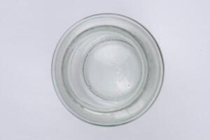 Top view of a glass of water on a white background. photo