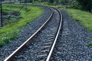 Train tracks in rural scene. Railroad in the park. vintage railroad close up. photo