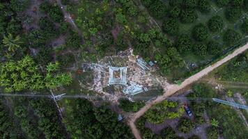 Architectural metal structures of frame base connection with rivets and reinforced metal structures. Assemble and install Steel Tower for power transmission lines for sustainable power development. photo