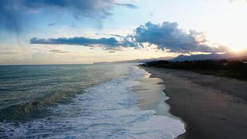 Ocean water with winter clouds in evening sky aerial video