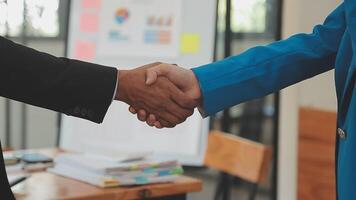 Close-up view of business partnership handshake, Photo of two businessman handshaking process. Successful deal after great meeting. Horizontal, flare effect, blurred background handshake concept. video