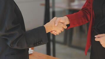 Close-up view of business partnership handshake, Photo of two businessman handshaking process. Successful deal after great meeting. Horizontal, flare effect, blurred background handshake concept. video