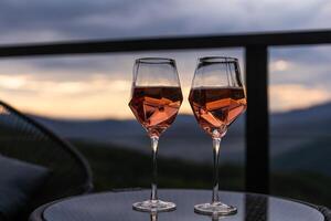 glasses of wine in mountains, closeup photo