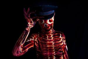 sensual woman dressed in a skeleton costume wearing a policeman's hat photo