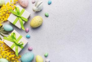 Festive Easter Celebration With Decorated Eggs and Gifts on a Light Background photo