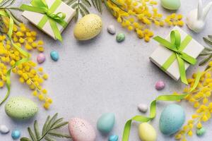 Festive Easter Celebration With Decorated Eggs and Gifts on a Light Background photo