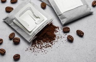 Drip coffee paper bags with coffee beans photo