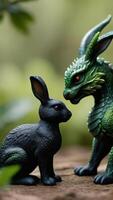 AI generated Photo Of A Black Rabbit And A Green Dragon Figurine Are Facing Each Other In A Close Encounter Set Against A Natural Backdrop Of Earth And Foliage. AI Generated