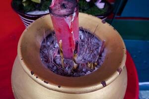 Selective focus of incense and candles used for worship. Great for Chinese New Year celebrations. photo