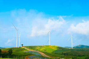 Wind turbines on the mountain of nature on blue sky at Khao Kho, Phetchabun, Thailand photo