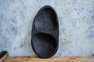 an oval rustic platter is on the table photo