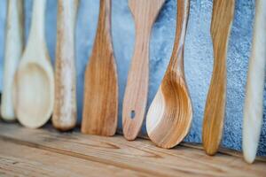 several wooden spoons on the table photo