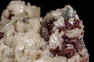 Macro stone Cinnabar dolomite mineral on a black background photo