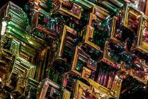Macro of the stone bismuth mineral on a black background photo