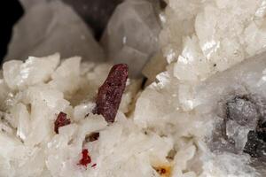 Macro stone Cinnabar dolomite mineral on a black background photo