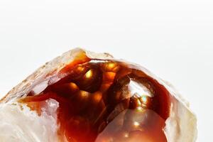 Macro mineral stone fiery Agate on a white background photo