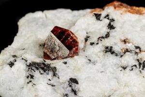 Macro Zircon mineral stone on a black background photo