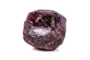 Macro of a mineral garnet stone on a white background photo