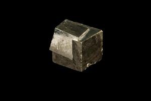 Macro mineral stone Pyrite on a black background photo