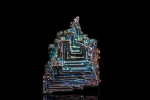Macro of the stone bismuth mineral on a black background photo