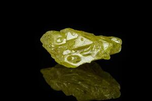 Macro mineral sulfur stone on a black background photo